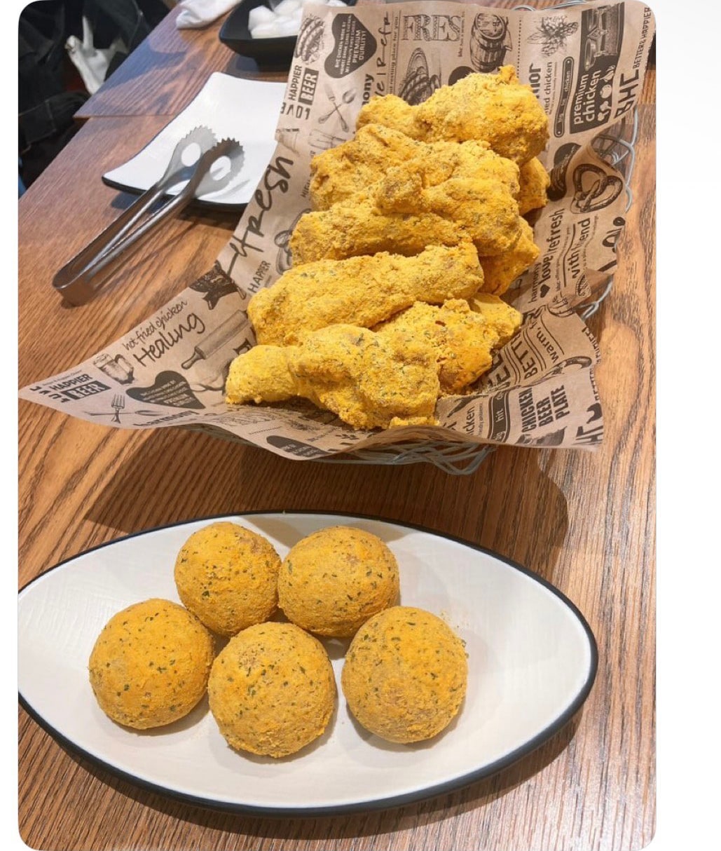 Korean community post, image 2: BHC's Bburinkle chicken and cheese balls, coated in cheese powder.
