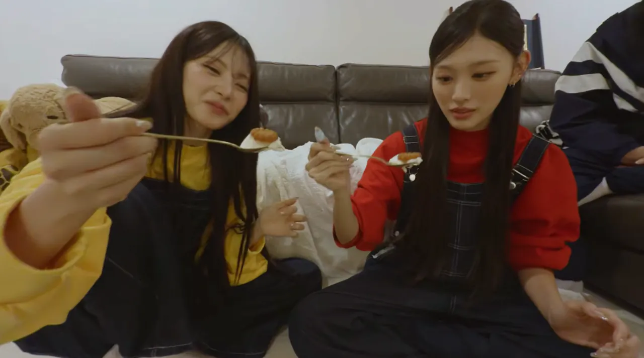 Korean community post, image 4: Spoon-deep in their late-night feast, grinning like it's the best part of the day.